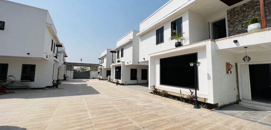 Executive 4 bedroom townhouse in a gated community of 5 with swimming pool at spintex for sale