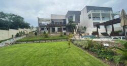 4 bedroom house with BQ, security post swimming pool on a 3 plots of land  now selling at Aburi peduase