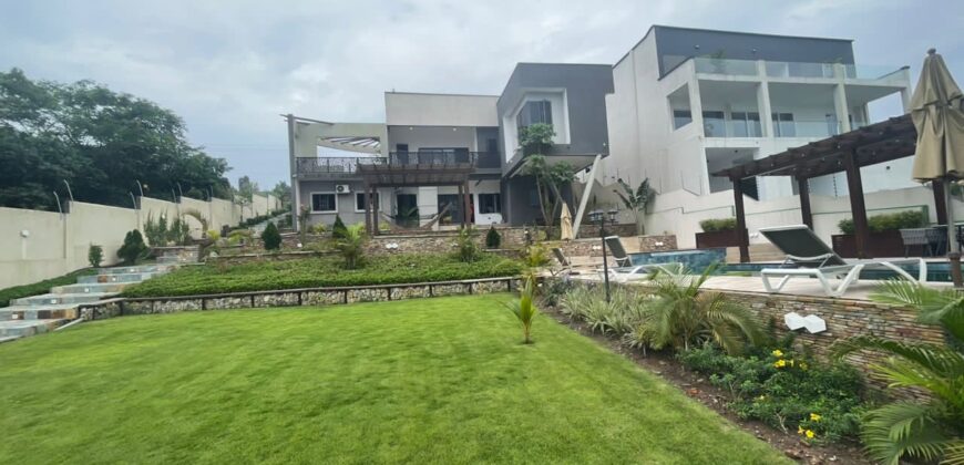 4 bedroom house with BQ, security post swimming pool on a 3 plots of land  now selling at Aburi peduase