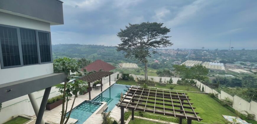 4 bedroom house with BQ, security post swimming pool on a 3 plots of land  now selling at Aburi peduase
