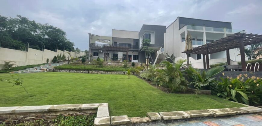 4 bedroom house with BQ, security post swimming pool on a 3 plots of land  now selling at Aburi peduase