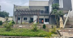 4 bedroom house with BQ, security post swimming pool on a 3 plots of land  now selling at Aburi peduase