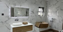 4bedroom with a boysquarters and a swimming pool for sale at school junction Botwe