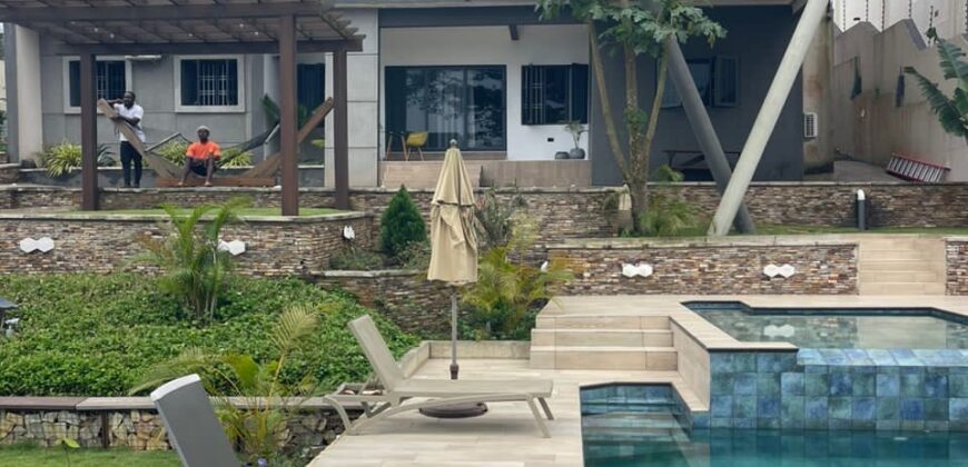 4 bedroom house with BQ, security post swimming pool on a 3 plots of land  now selling at Aburi peduase