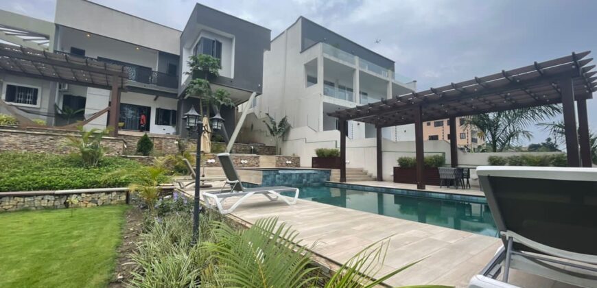 4 bedroom house with BQ, security post swimming pool on a 3 plots of land  now selling at Aburi peduase