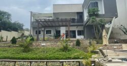 4 bedroom house with BQ, security post swimming pool on a 3 plots of land  now selling at Aburi peduase