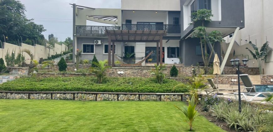 4 bedroom house with BQ, security post swimming pool on a 3 plots of land  now selling at Aburi peduase