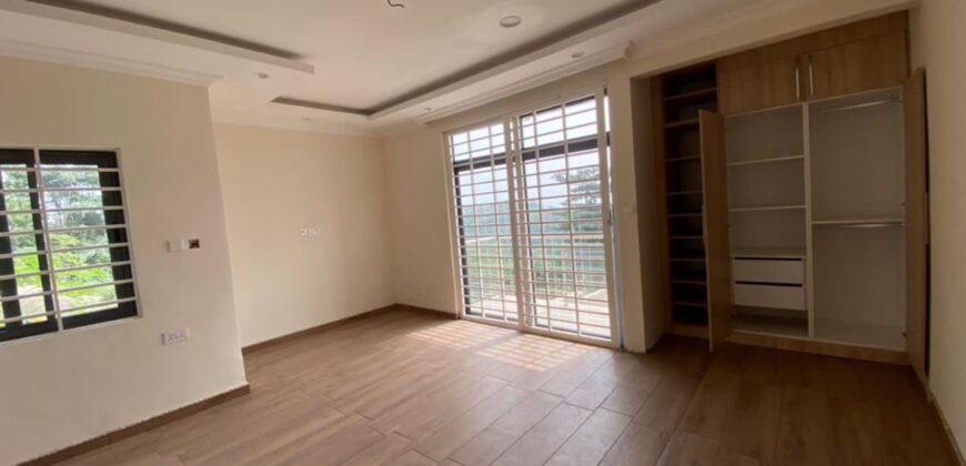 Alert ultra modern 4 bedroom house with BQ , security post situated on 1.5 plots of land underground basement now selling at Aburi