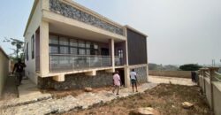 Alert ultra modern 4 bedroom house with BQ , security post situated on 1.5 plots of land underground basement now selling at Aburi