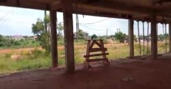 1.231 Acre landed property || uncompleted shop || block factory for sale at Oyibi