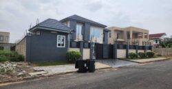 modern mansion within a gated community at Airport Hills