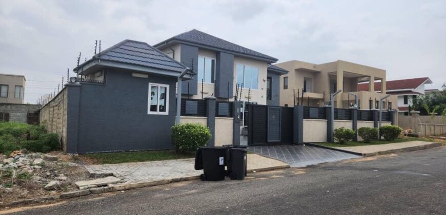 modern mansion within a gated community at Airport Hills