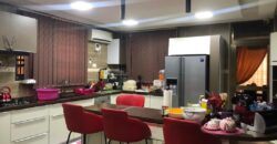 modern mansion within a gated community at Airport Hills