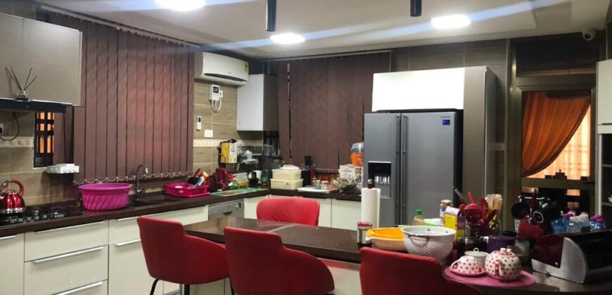 modern mansion within a gated community at Airport Hills