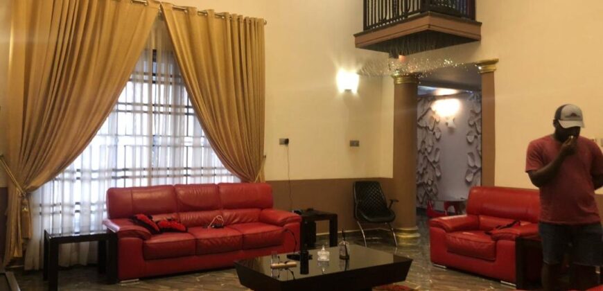 modern mansion within a gated community at Airport Hills