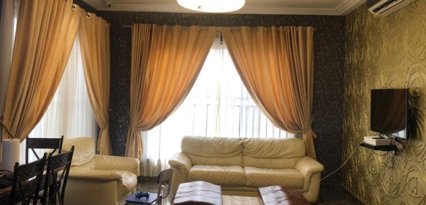 modern mansion within a gated community at Airport Hills