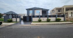 modern mansion within a gated community at Airport Hills