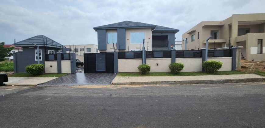 modern mansion within a gated community at Airport Hills