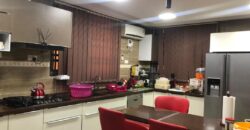 modern mansion within a gated community at Airport Hills