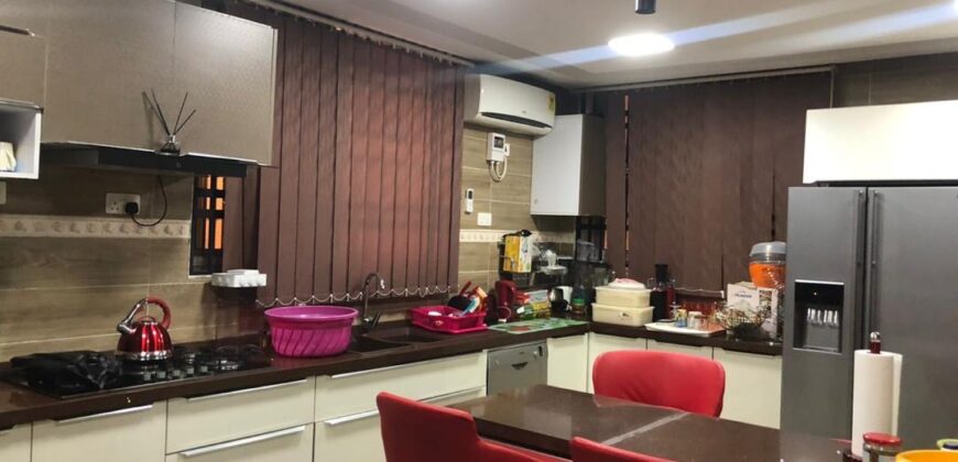 modern mansion within a gated community at Airport Hills